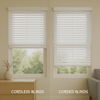A bright modern room showing cordless blinds on one window and corded blinds on the other, illustrating the difference in safety and design between the two types.