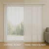 A modern living room with large sliding doors showing a comparison of vertical blinds on one side and panel track blinds on the other, illuminated by soft natural light.
