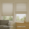 A modern living room showing side-by-side windows with cellular shades and Roman blinds, highlighting differences in texture, insulation, and style under natural light.